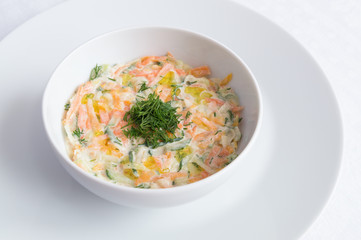 ratia of grated cucumber, carrot, daicon, pumpkin, and dill dressed with olive oil and yogurt 