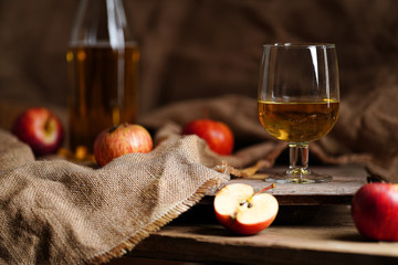 Apple cider on the wooden background