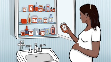 Woman Checking Medicine Label in Bathroom Cupboard