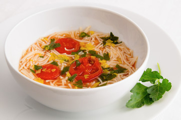 a bowl of tomato soup with vermicelli