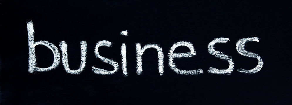 BUSINESS - in a title word for business coaching, mentoring, strategy, inspiration, categories, concepts & ideas - in panorama / header / banner, written in chalk letters on a chalkboard.