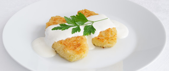 fried cutlets of white cabbage and semolina served with sour cream