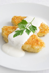 cabbage cutlets with semolina served with sour cream