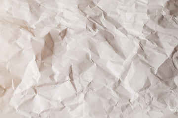 Crumpled white paper background.