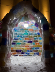 A multi-colored igloo is an ice house made of ice cubes of different colors on a winter night. This very beautiful colorful igloo was built from small pieces of ice. This is a unique building