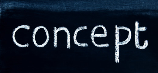 CONCEPT - in a title word for business coaching, mentoring, innovation, R&D, strategy, inspiration, concepts & ideas - in panorama / header / banner, written in real chalk letters on a chalkboard.