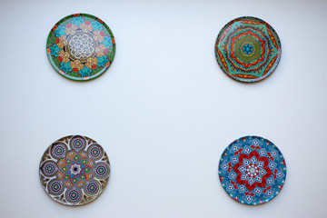Multi-colored plates on a white background