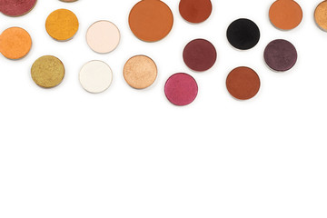 Round multicolored make up eyeshadows isolated on white.