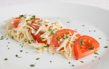 tomato cabbage salad decorated with parsley