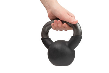 Black weight isolated on white in woman hand. 4 kg weight.