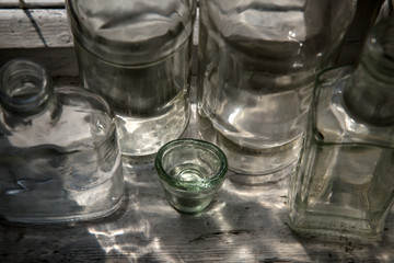 Different glass bottles on the windowsill.