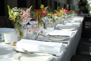 empty wine glasses on a beautifully set dinner table