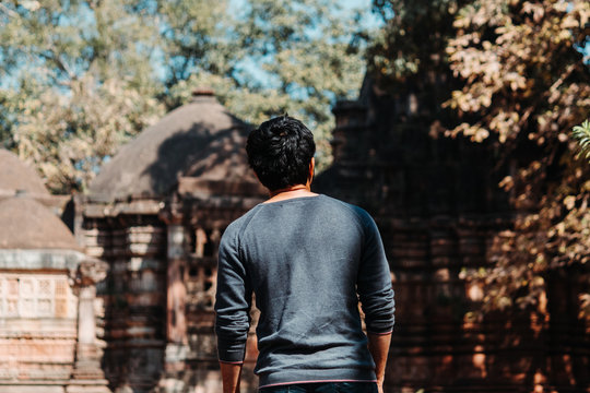 Indian male tourist standing in front of the temple at Polo Forest in Gujarat, India