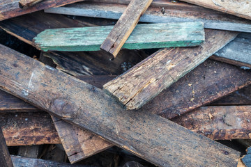 Old wooden boards after the collapsed house