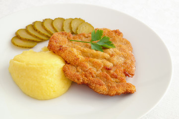 chicken schnitzel with potato and cucumber