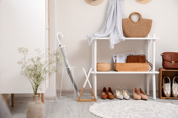 Stylish interior of modern hall with spring flowers