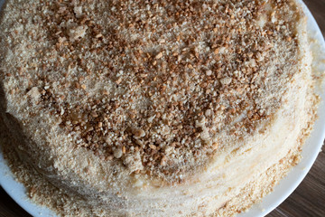 Dessert Napoleon cake close-up. View from above. Napoleon cake on a wooden table
