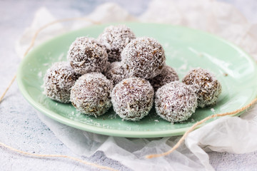 Sweet chocolate vegan truffles. Protein energy coconut healthy dessert. Homemade.
