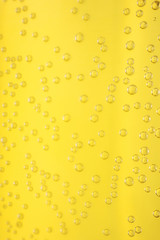 Carbonated drink close-up. Beer, lemonade. Detailed closeup. Bubbles in a liquid.