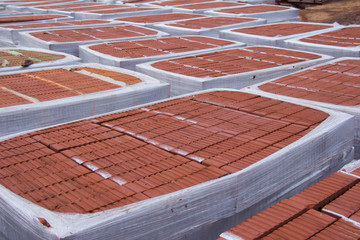 Stack of Red clay brick. Building brick