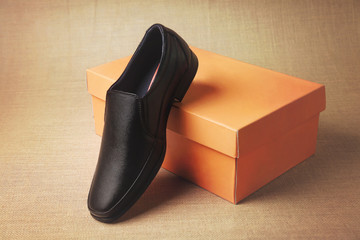 Black leather elegant shoes on box