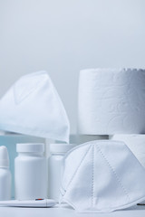 Pills, thermometer and face masks on store shelf hospital supplies