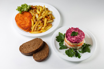 Multi-course dinner offer on white plates.