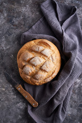 Homemade gluten free bread on a napkin on the kitchen table