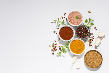 Assortment of spices and herbs on white background. Template recipe book or culinary blog social media.