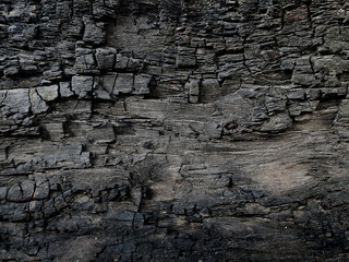 Charcoal crayon Carbon black background . A large plank of wood burned texture .