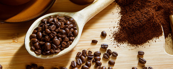 Coffee beans - concept for enjoying the taste & flavors of real coffee -  panorama /  header / banner.