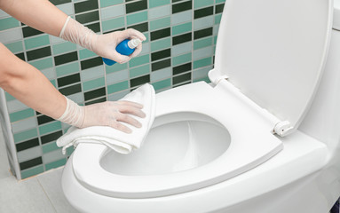 Deep cleaning disinfect for Covid-19 disease prevention. alcohol,disinfectant spray on Wipes of toilet in home for safety,infection of Covid-19 virus,contamination,bacteria that are frequently touched