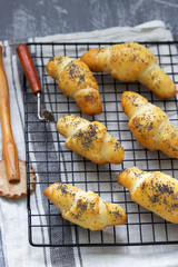 Crescent or kifli roll with poppy seeds and jam.