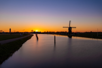 Fototapeta premium Sunset at a Dutch windmill