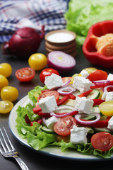 A plate full of bright fresh vegetable salad