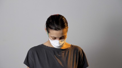 Fototapeta premium Portrait of woman in a protective medical mask. Coronavirus or COVID-19.