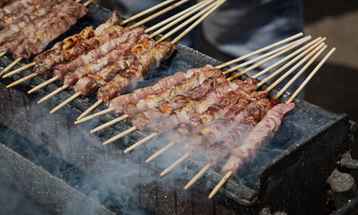 Arrosticini cooked outdoors, Campo Imperatore, Abruzzo, Italy