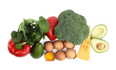 Fresh products rich in vitamin A on white background, top view