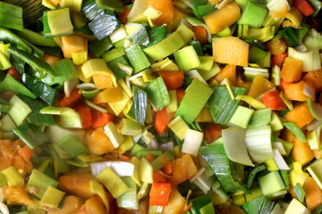 Chopped leek, carrot and butternut squash in a wok. Top view.