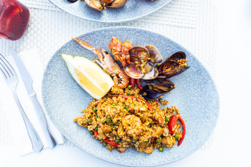 Portion of very tasty seafood paella in the plate