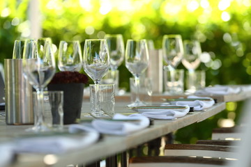 beautiful wine glasses on a set dinner table