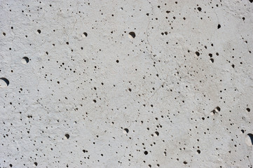 Concrete wall with air pores - "lunar craters".