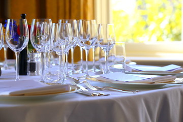 beautiful wine glasses on a set dinner table