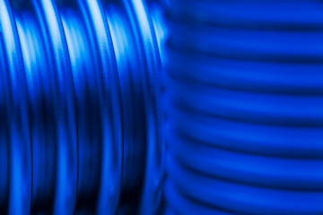 Close-up of a blue corrugated pipes or tubes of steel