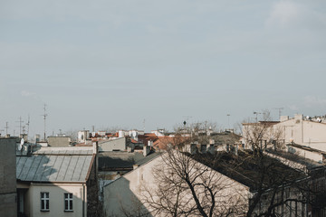 Roofs of the apartment houses in Poland city of Kraków during the sunny winter day