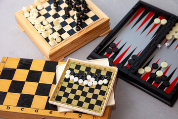 Board games on the table. Chess, backgammon, checkers. Boards are laid out for the game. Play, have...