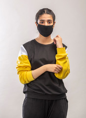 Portrait of a  teenager girl with protective mask to protect from Novel coronavirus pandemic in India