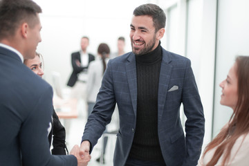 business people meeting each other with a handshake.