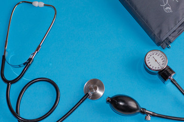 Aneroid blood pressure kit for pressure measurement on a blue background. medical concept, health...