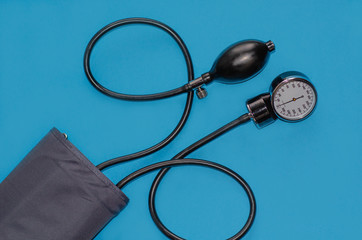 Aneroid blood pressure kit for pressure measurement on a blue background. medical concept, health...